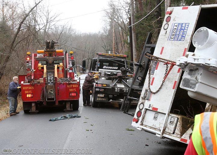 Rollover of a bucket truck for tree work on Mills Road, 12/12/16