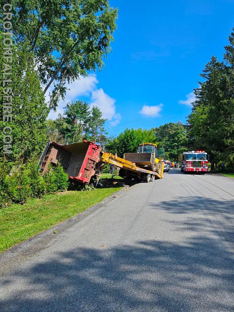 Rollover while loading a machine on a trailer on Westview Cross Road, 09/06/23